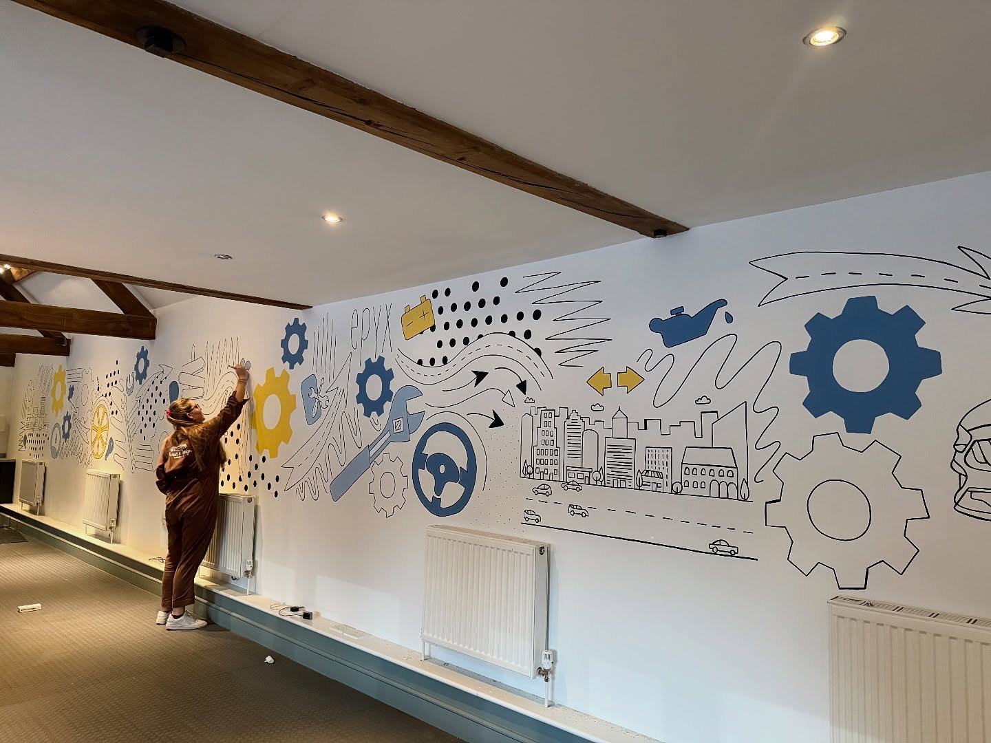 A very busy but successful couple of days! We&rsquo;ve been working with Epyx to create a mural that reflects their brand and company history, painting a piece that spans 14m across their office walls 🚗⚙️