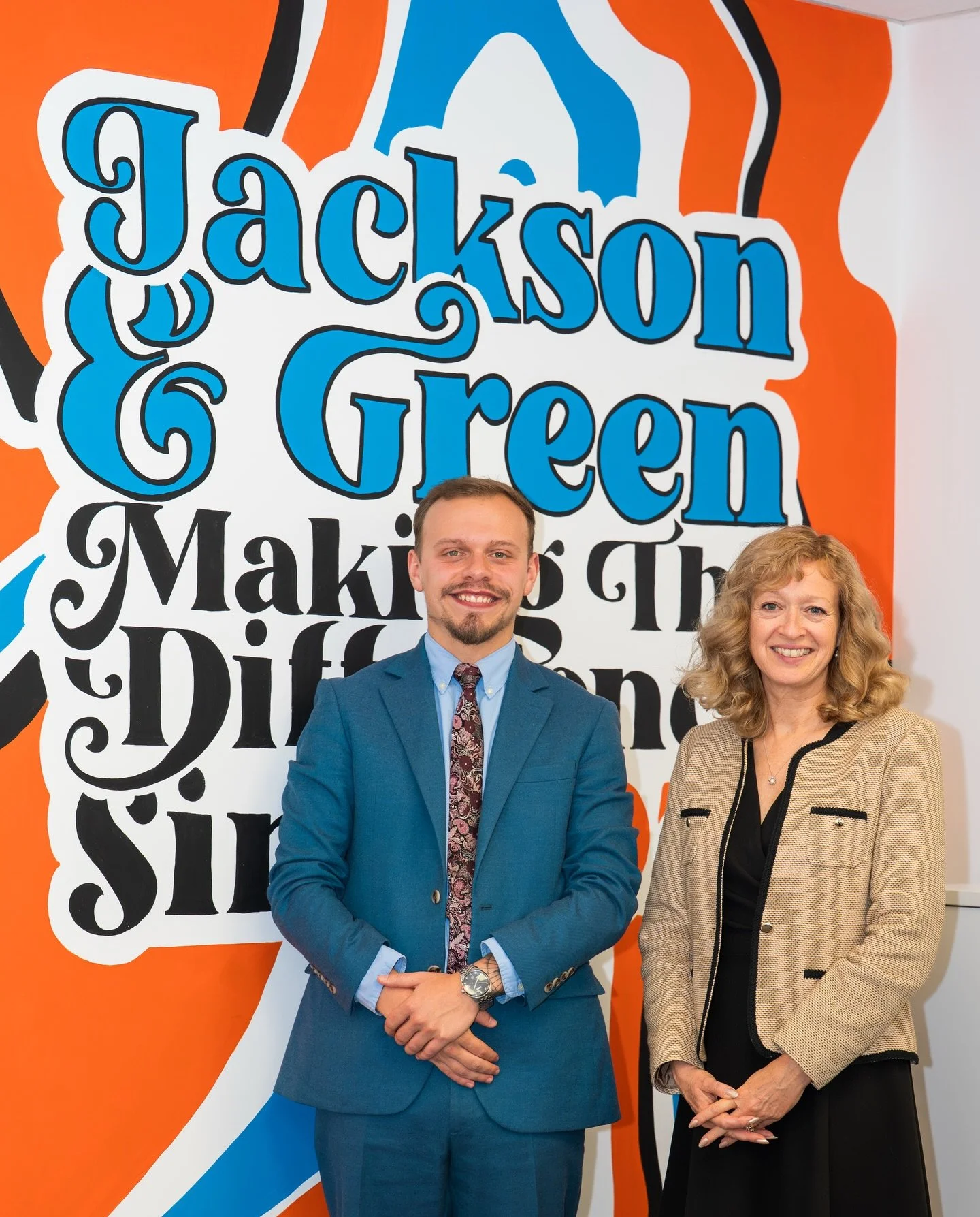 Love to see our mural being used as a background for office photo shoots! If your office is in need of a little personality, send us a message 🧡🩵