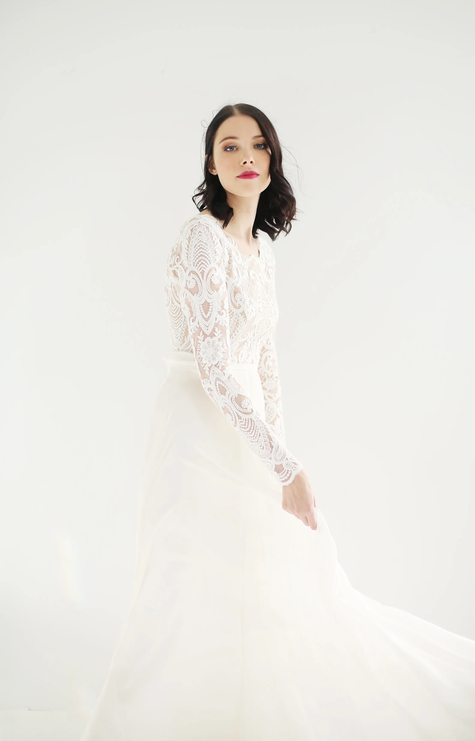 light ivory long sleeve lace bodice gown with nude front lining. Long, sheer lace sleeves and sheer lace back. A-line light ivory featherweight chiffon skirt
