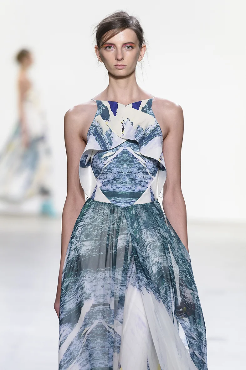 Printed cotton/silk twill dress with short sleeves. Dress has relaxed fit with diamond shaped seaming, keyhole slit opening in front neck and back with two pockets at front