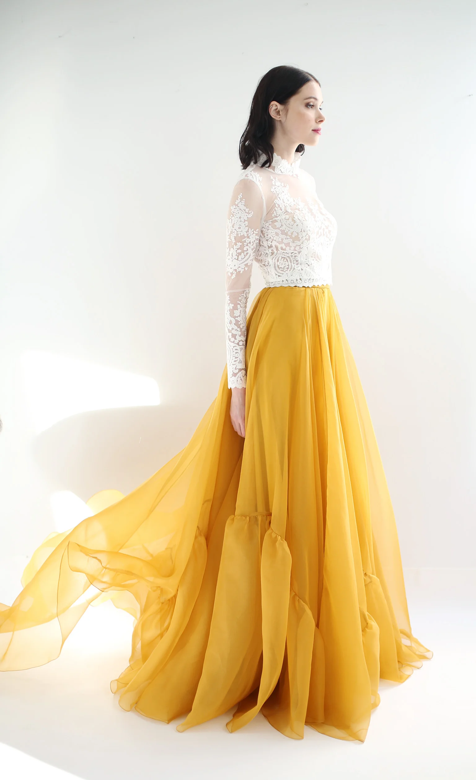 Copy of Silk organza skirt in a very full circle with added volume panels on bottom. Waist-band, train and zipper up the back. Available in Ivory or Autumn Gold