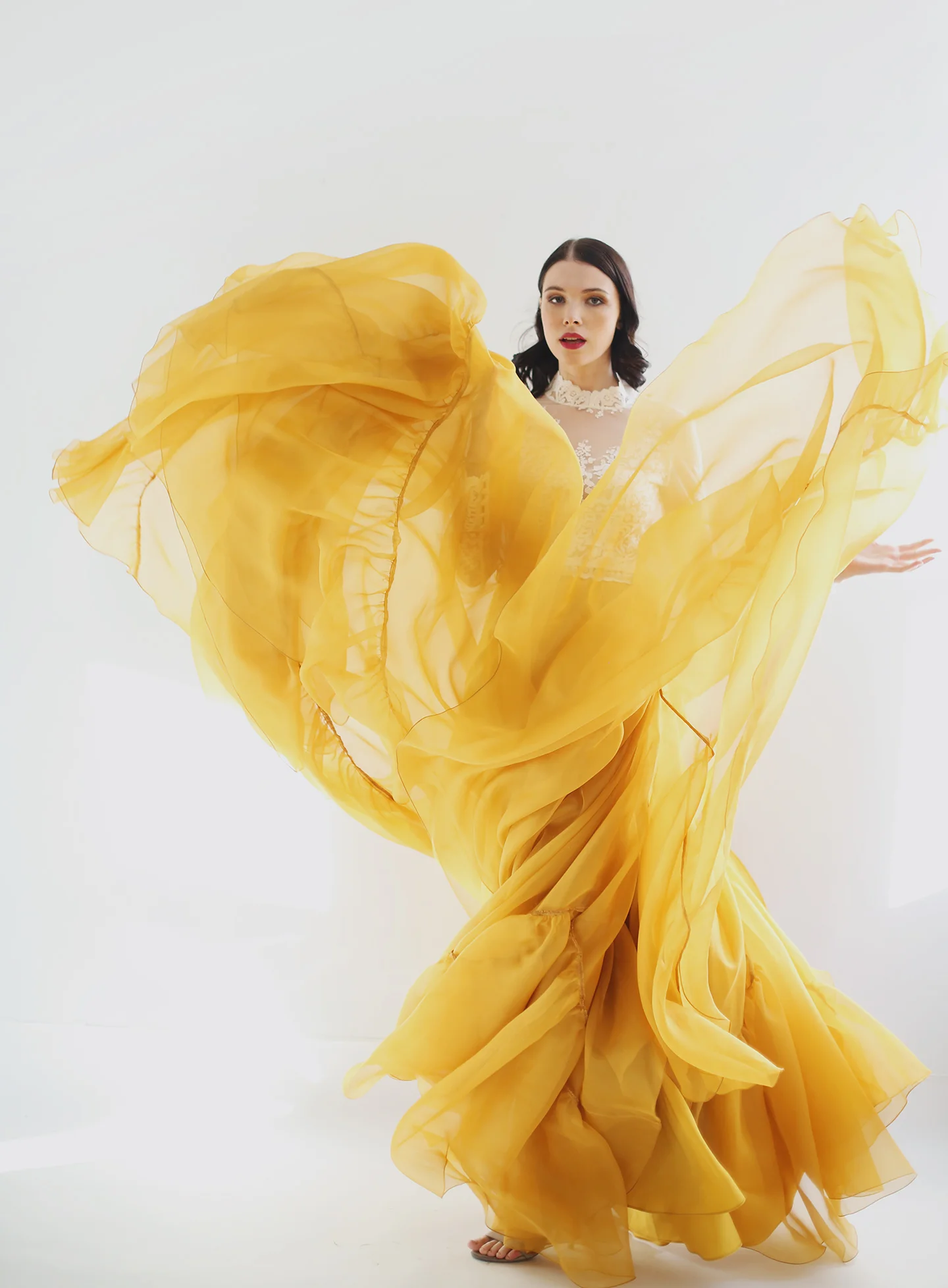 Copy of Silk organza skirt in a very full circle with added volume panels on bottom. Waist-band, train and zipper up the back. Available in Ivory or Autumn Gold