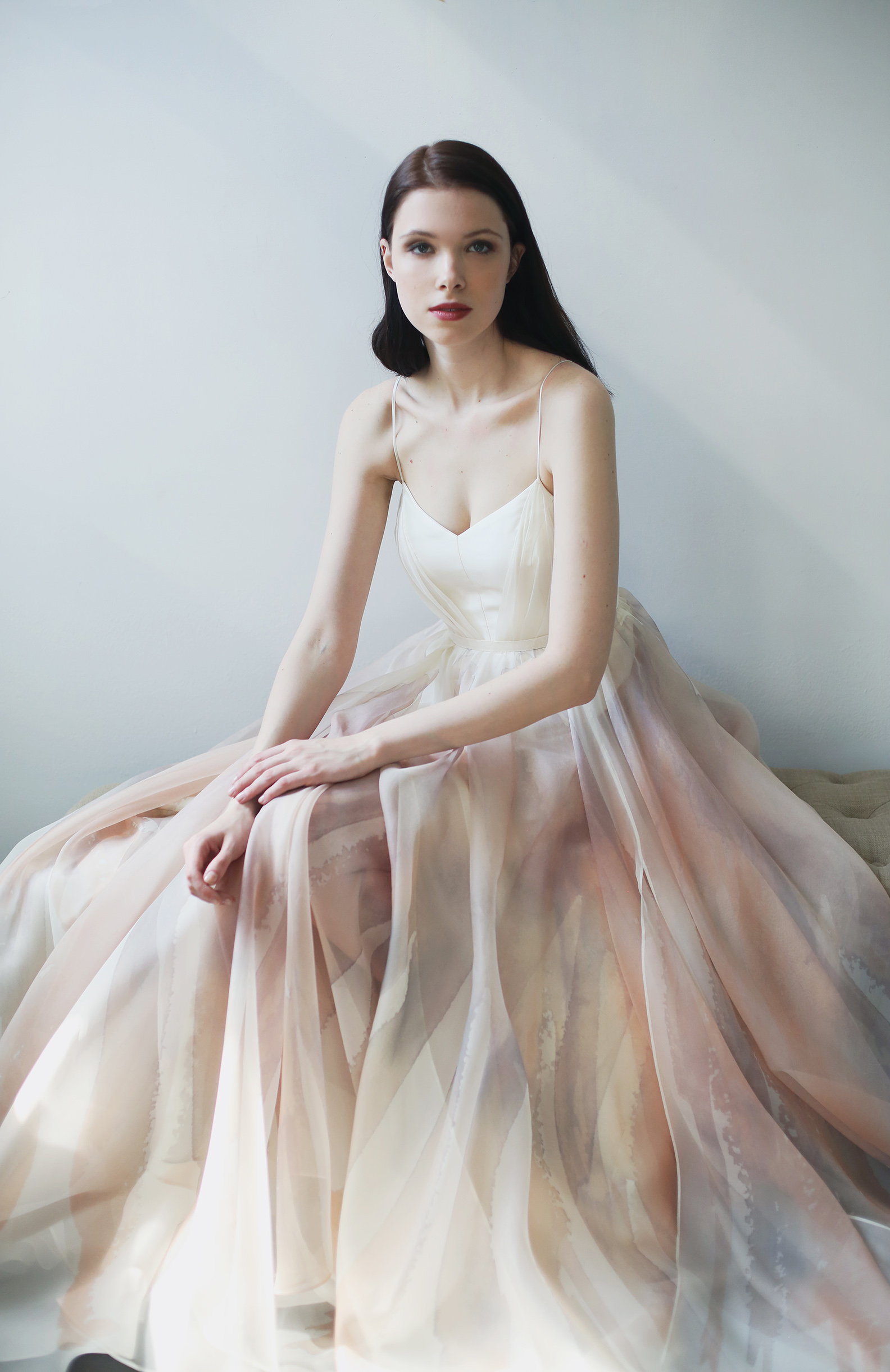 Ivory, blush and mauve printed silk organa gown with ivory draped V neck bodice and racerback. Full A-line skirt with side slit and added flounces. Closes with zipper up the back.
