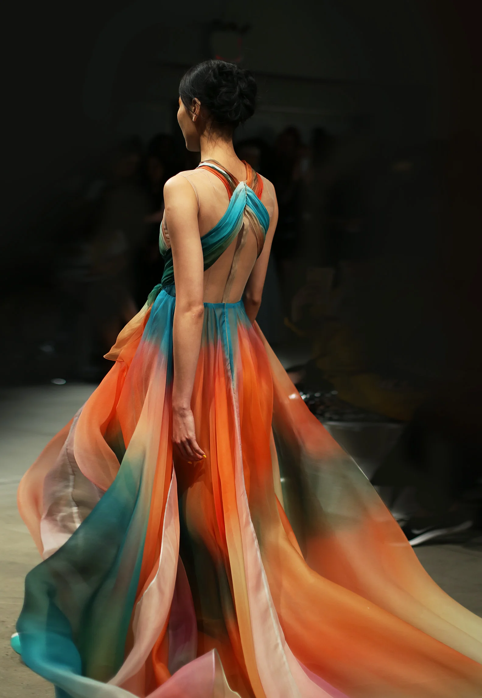 Tropical sunset printed silk organza gown with draped bodice over nude illusion netting, full A-line gown with layers of silk. Fully lined in charmeuse. Closes with zipper up the back. 