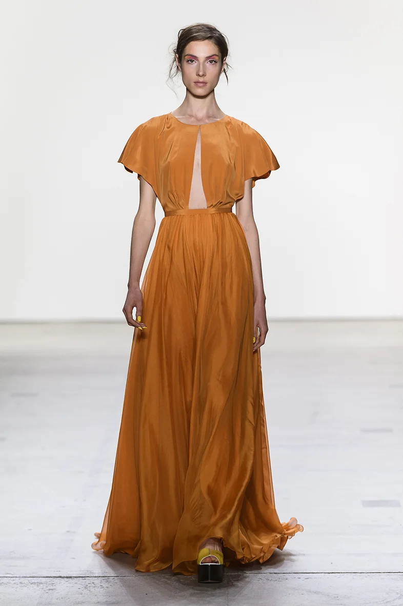 Orange inverted V-neck draped silk chiffon gown with short flutter sleeves and A line silk chiffon chiffon skirt.