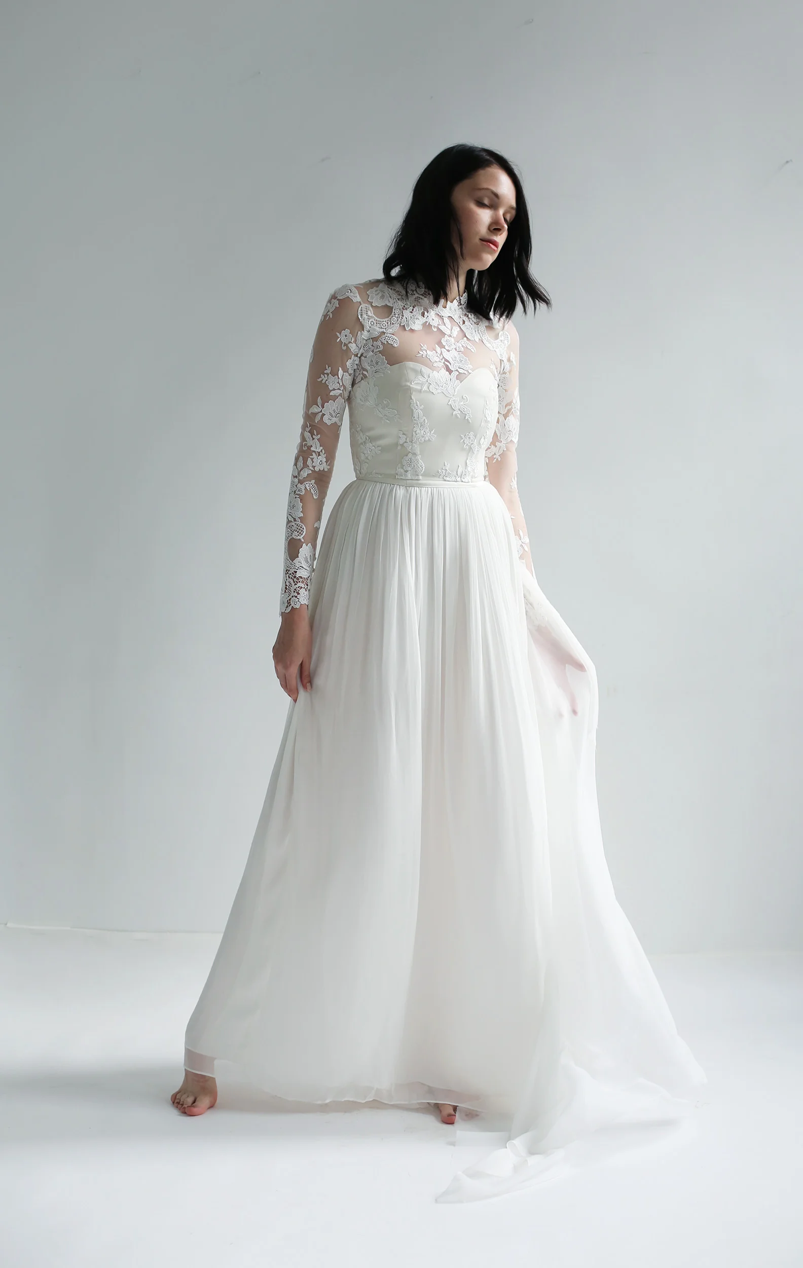 light ivory silk chiffon strapless sweetheart gown with removable long sleeve lace top. Boned bodice, lined in silk and has zipper closure up the back.