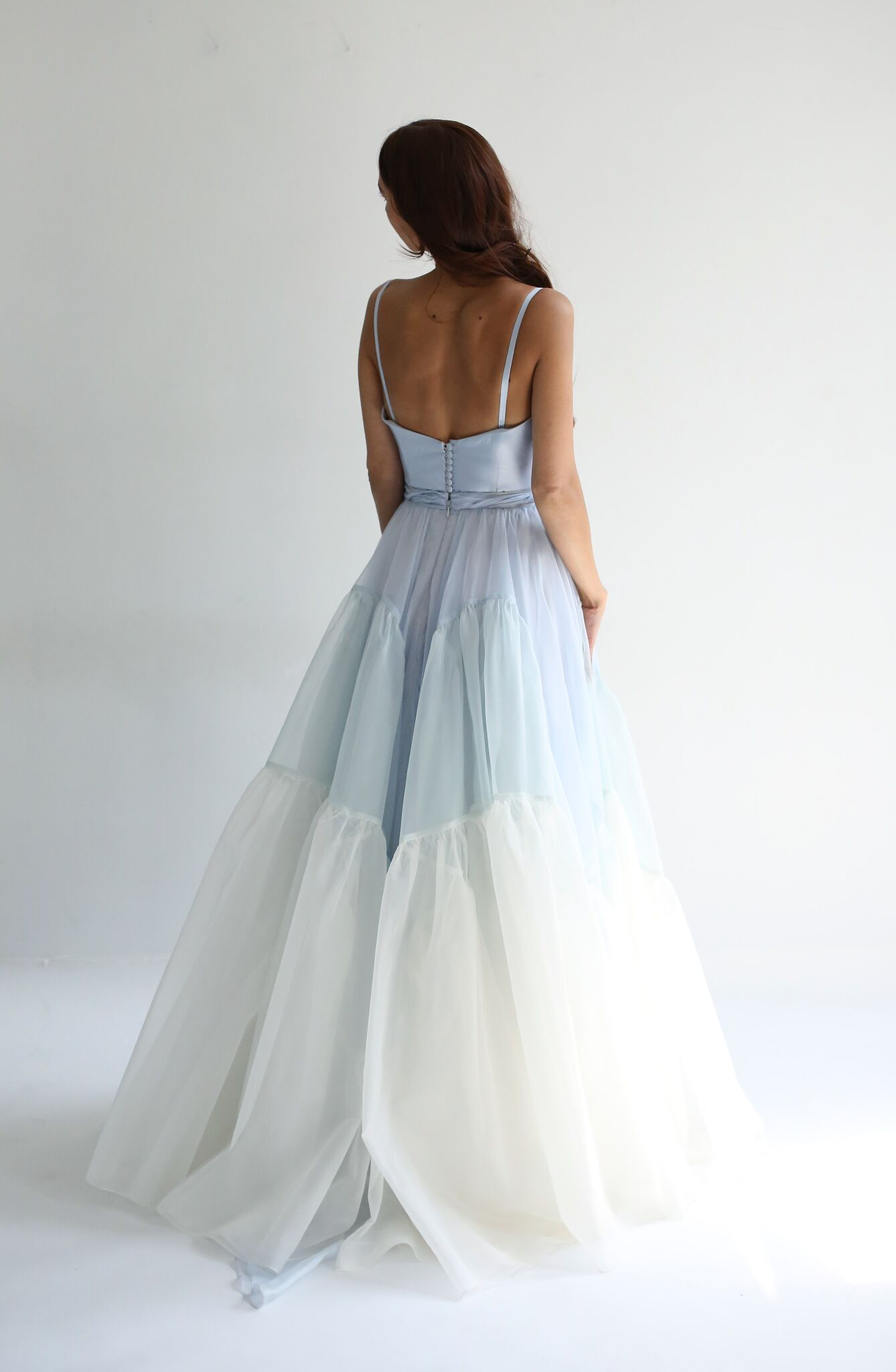 Full skirt in silk organza with 2 gathered section volume panels. Zipper up back. Available in Ivory or Blue Sky.