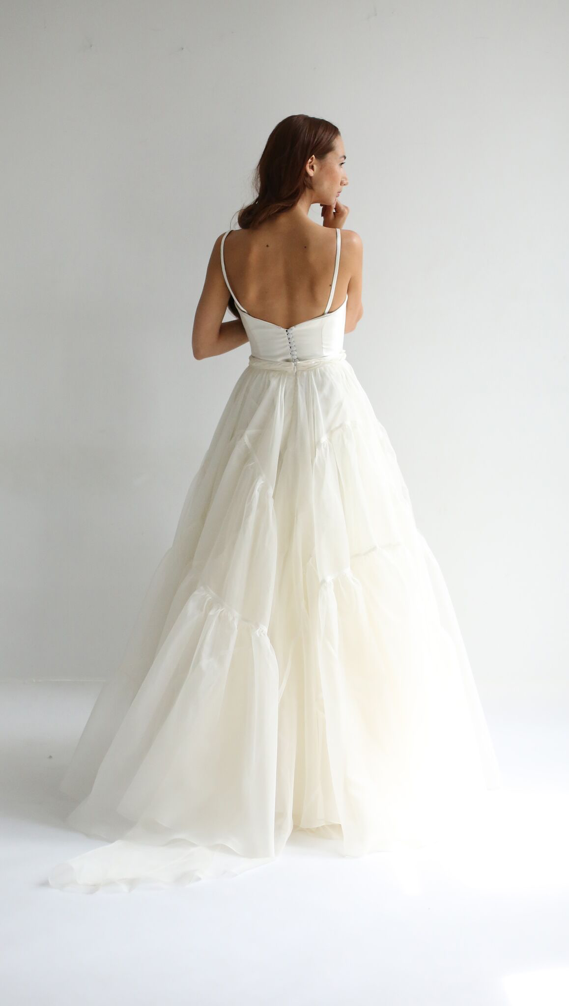 Full skirt in silk organza with 2 gathered section volume panels. Zipper up back. Available in Ivory or Blue Sky.