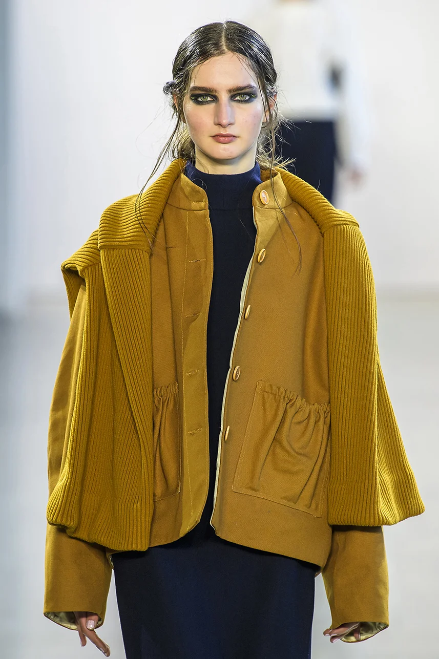 Rich organic cotton canvas jacket with pouch pockets. Fully lined in silk. Button up front and boxy oversize fit.