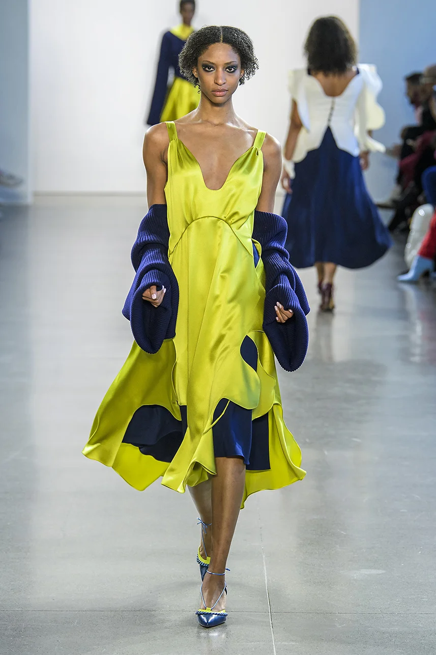 Chartreuse silk double charmeuse dress with scalloped wave cut-out skirt. (shown layered over navy slip) Soft gathering at bust. Zips up back. Skirt can be tied closed with attached strings.