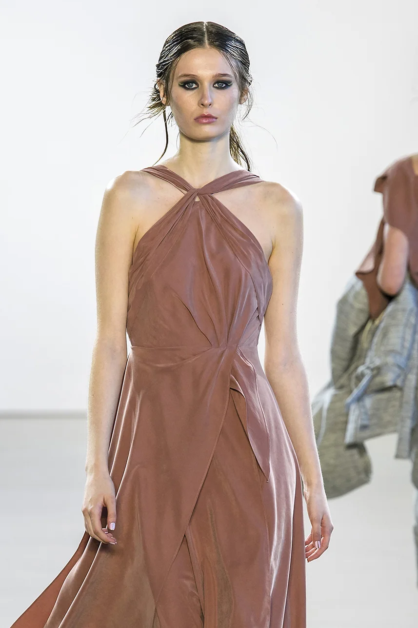 usty rose blush dress in a fine sustainable sueded Tencel gabardine blend. Structured, boned bodice with asymmetrical draping and darts. Open cut back. Zipper up back.