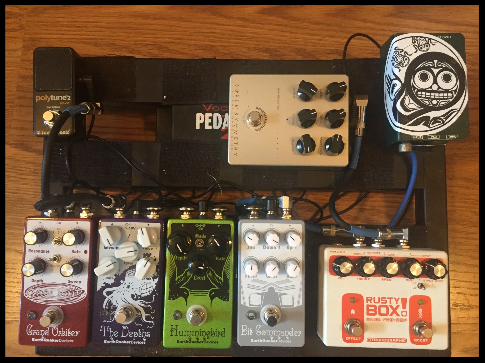 Signal Flow: Electrical Guitar Company Series One Bass -> DarkGlass Super Symmetry Compressor -> Tronographic Rusty Box Bass Pre-Amp -> Bit Commander Octave Synth -> Hummingbird Repeat Percussions -> The Depths Optical Vibrato -> Grand Orbiter Phaser -> TC Electronic PolyTune 2 Noir -> Tech 21 Sansamp RBI