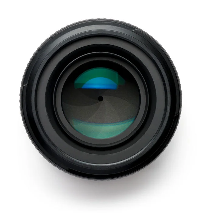 31760068 - 50mm camera lens on white