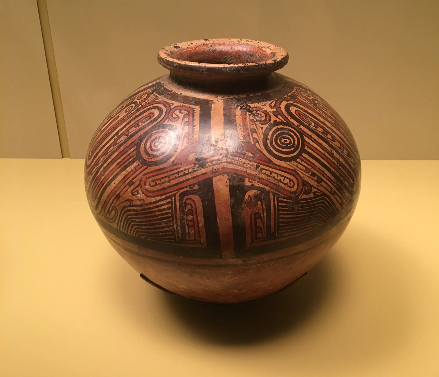 Greater Cocle jar with crocodile design, AD 950-1100. Parita, Herrera Province, Panama. Pottery, clay slip, paint. MAI purchase from Philip L. Dade, 1964. 