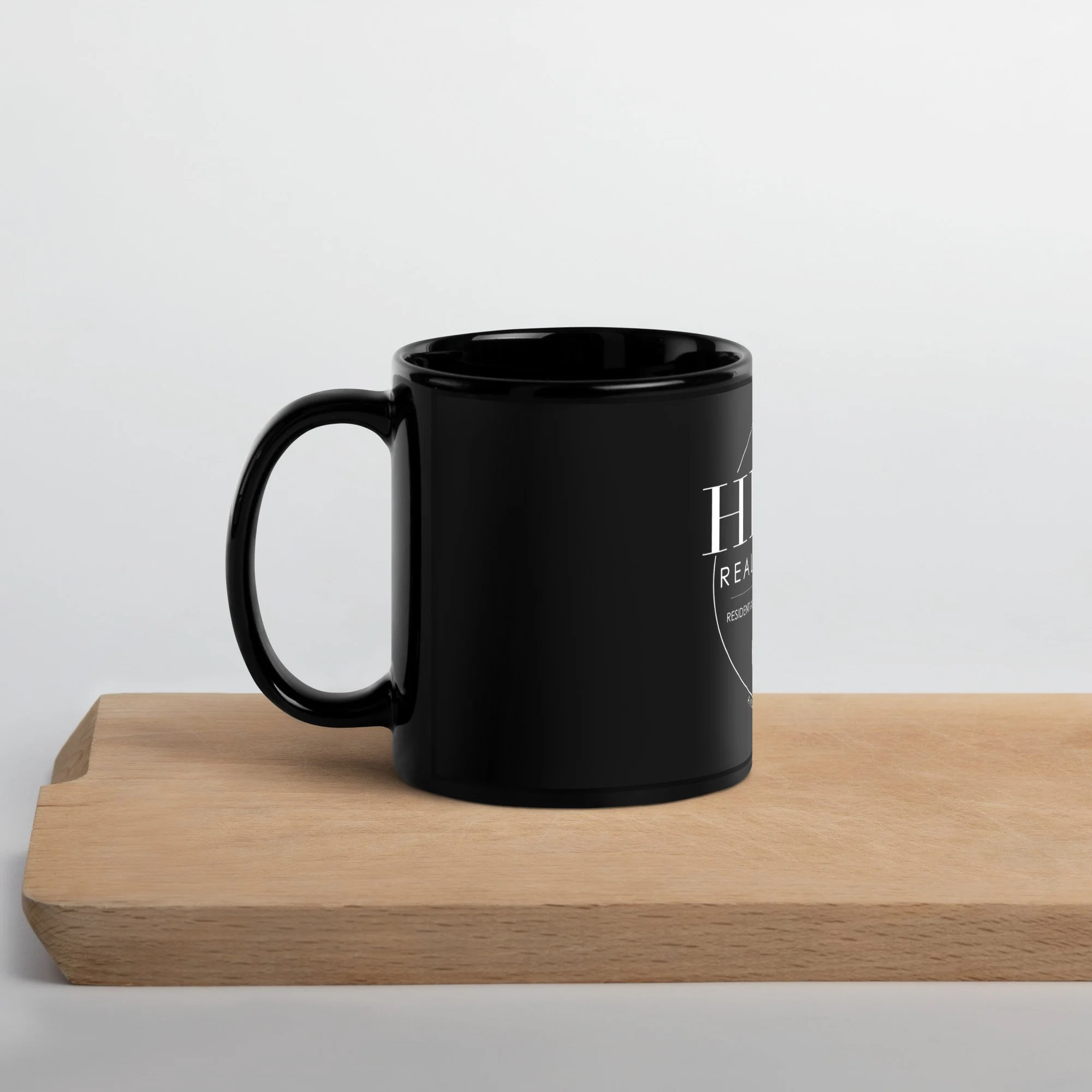 black-glossy-mug-black-11oz-handle-on-left-63c0263174cde.jpg