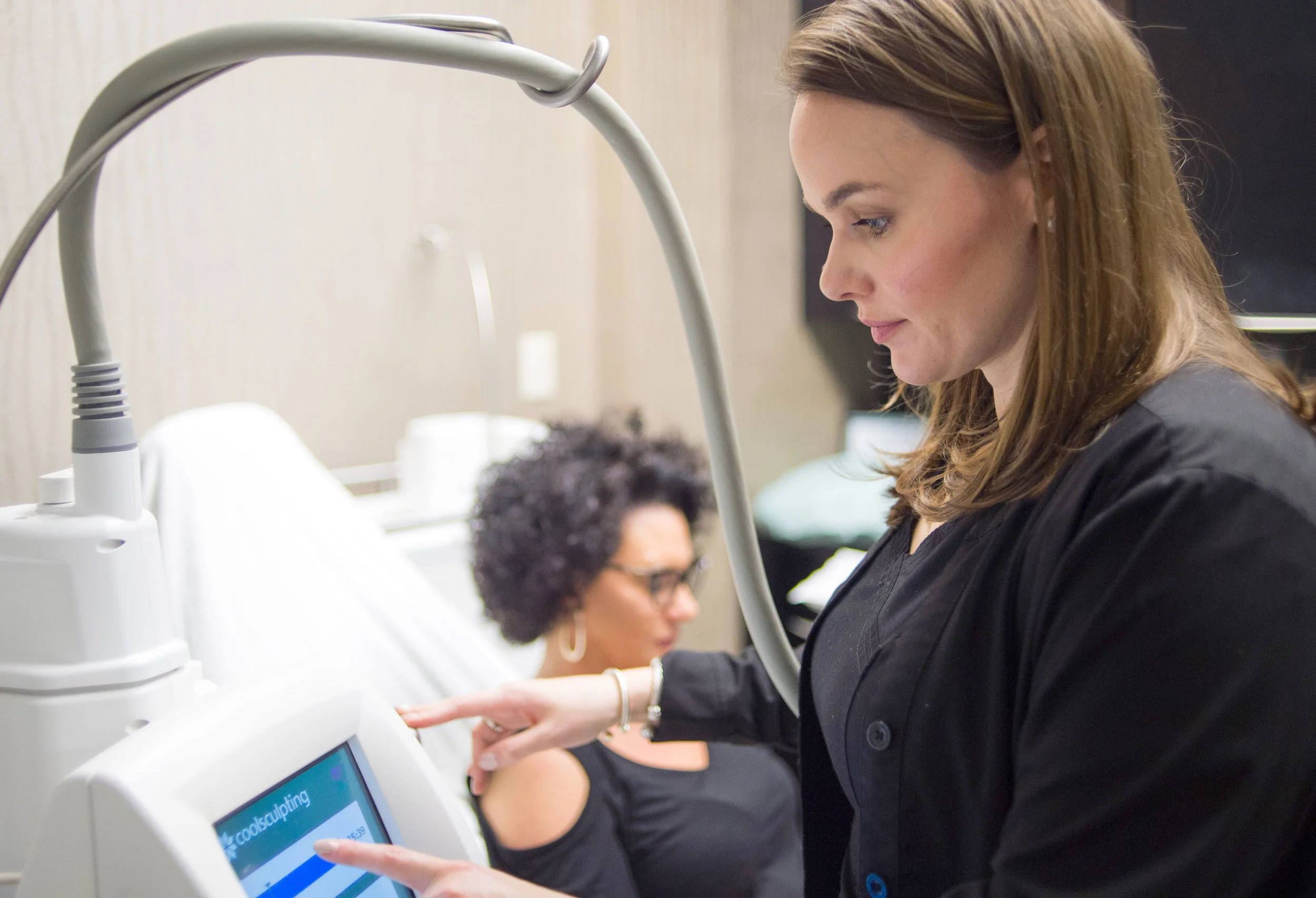 Patient receiving treatment at a Live CoolSculpting Demonstration.