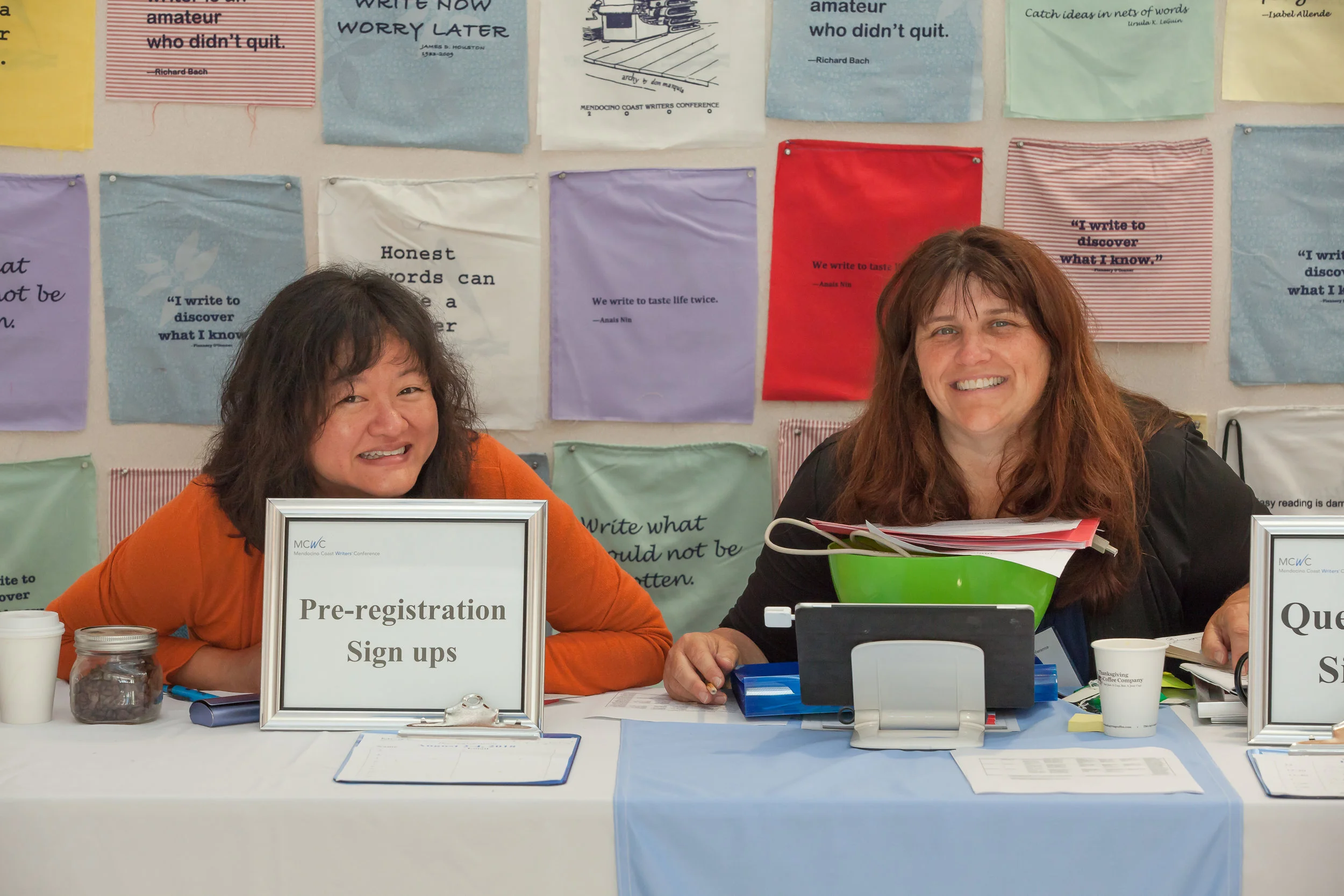 Past ED Shirin Bridges and Board Member Amie McGee manning the registration desk at MCWC 2017