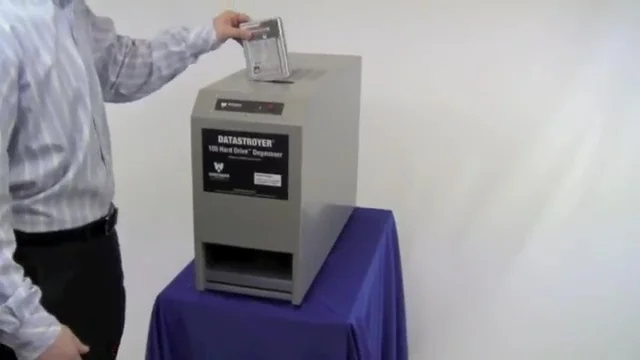 Inserting a hard drive into a slot style degausser