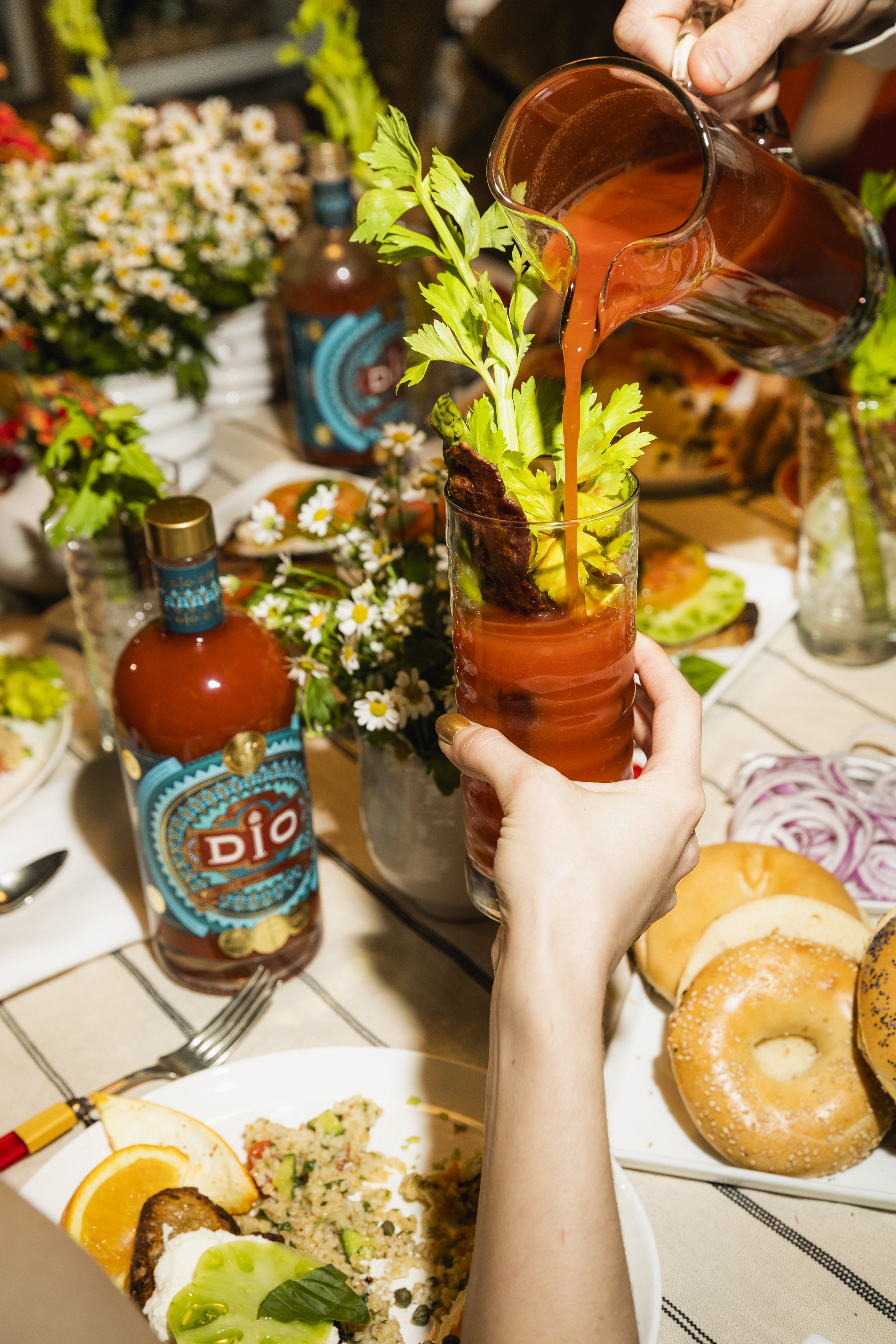 A table set for a party featuring cocktails mixed with Drink Dio