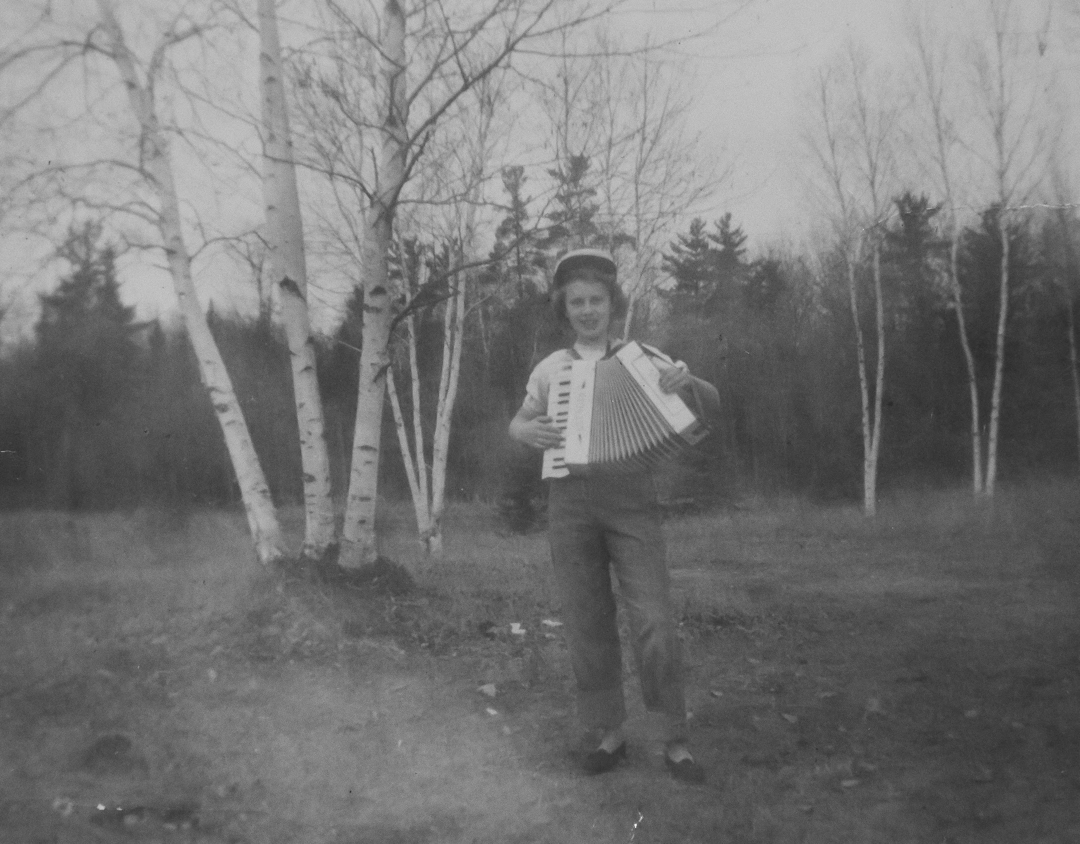 Caption written by my dad. “My mother as a teenager playing the accordion at the old Bodin homestead west of Glen, Minnesota (1949 approx). Her father played in the marching band in WW I, and he taught her how to play the accordion before his untimely death (my mother was only 11). Mom has always loved music, and I remember her playing the accordion and organ many times in my youth. She was so proud of us kids (and grandkids) when we also learned how to play instruments. She was fun, creative and adventuresome, traits I see today in my children and grandchildren.”