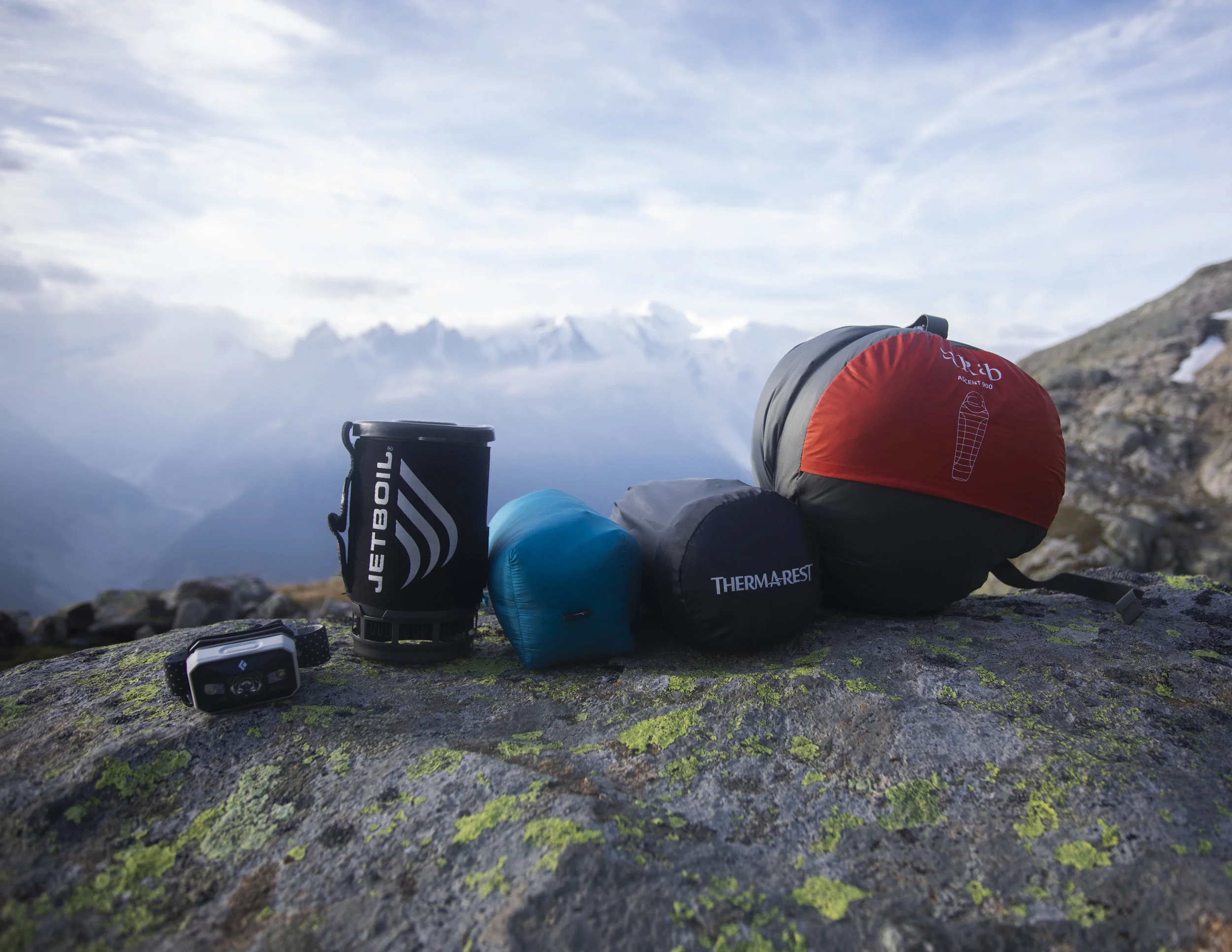 Some of my basic gear with the Mont Blanc behind. From left to right. Black Diamond Storm headlamp, Jetboil, Arc’teryx Cerium LT Down jacket, Thermarest NeoAir Xtherm, Rab Ascent 900 sleeping bag.