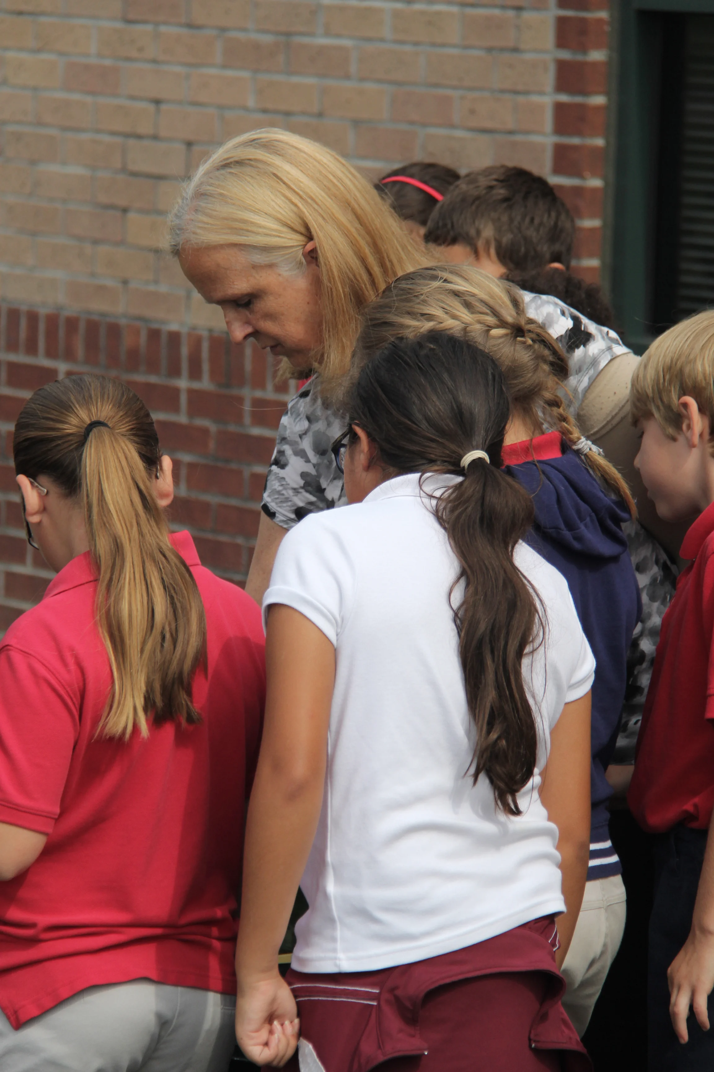 Morgan brings out her students, to check on their garden in the back of the school. Photo by Monica Velasquez.