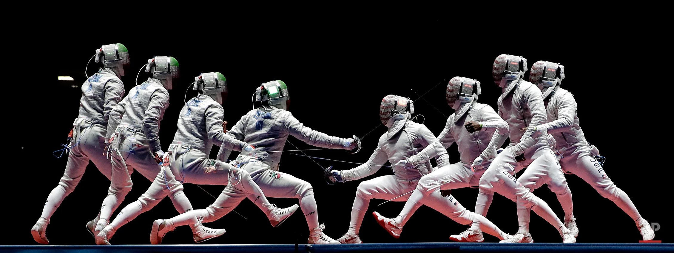 In a photo taken using multiple exposure, Iran's Mojtaba Abedini, left, and United State's Daryl Homer compete in a men's individual sabre semifinal at the 2016 Summer Olympics in Rio de Janeiro, Brazil, Wednesday, Aug. 10, 2016. (AP Photo/Charlie Riedel)