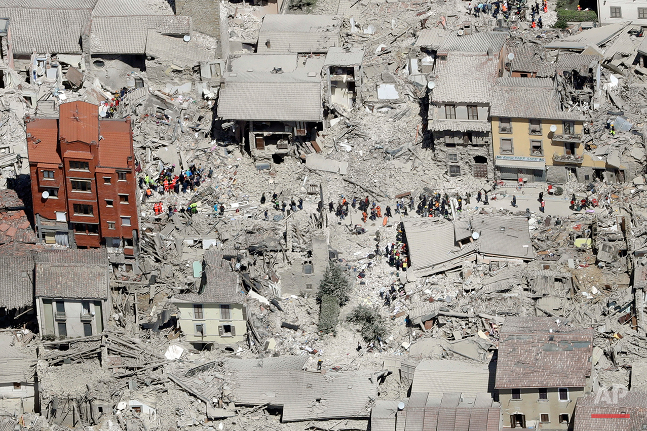 This aerial photo shows the damaged buildings in the town of Amatrice, central Italy, after an earthquake, Wednesday, Aug. 24, 2016. The magnitude 6 quake struck at 3:36 a.m. (0136 GMT) and was felt across a broad swath of central Italy, including Rome where residents of the capital felt a long swaying followed by aftershocks. (AP Photo/Gregorio Borgia)