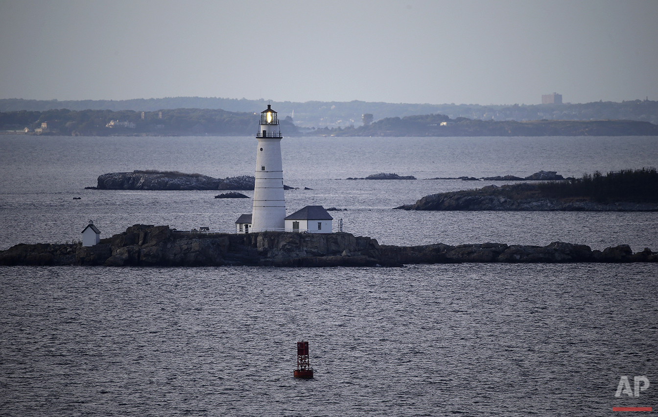  In this Aug. 25, 2016 photo, Boston Light, America's oldest lighthouse, flashes in Boston Harbor as seen from Hull, Mass. (AP Photo/Elise Amendola)&nbsp;See these photos on  APImages.com  