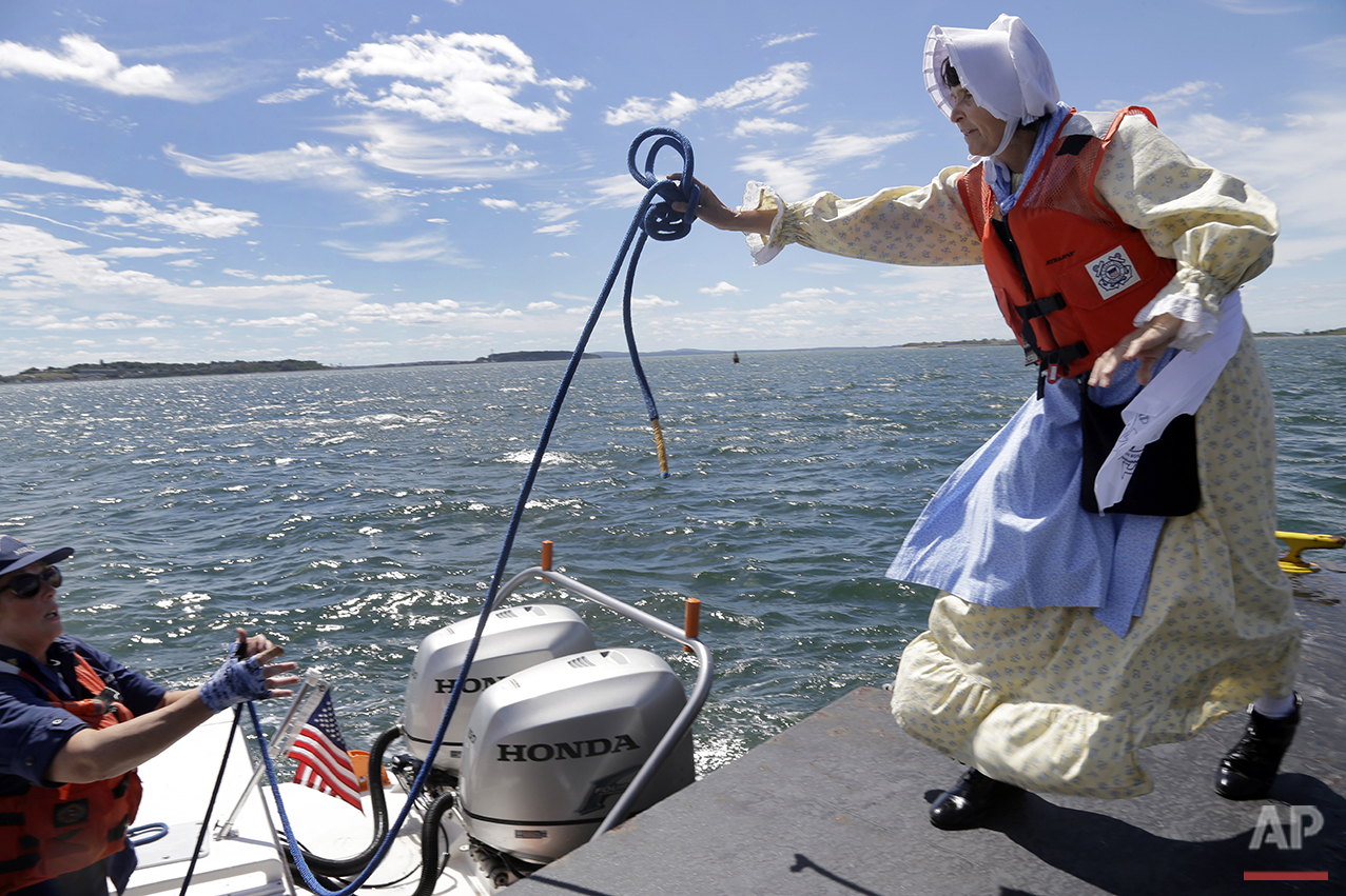 In this Aug. 17, 2016 photo, Sally Snowman, right, the keeper of Boston Light, tosses a line to Robin Young of the Auxiliary Coast Guard at the dock of Little Brewster Island in Boston Harbor. (AP Photo/Elise Amendola)&nbsp;See these photos on  APIm