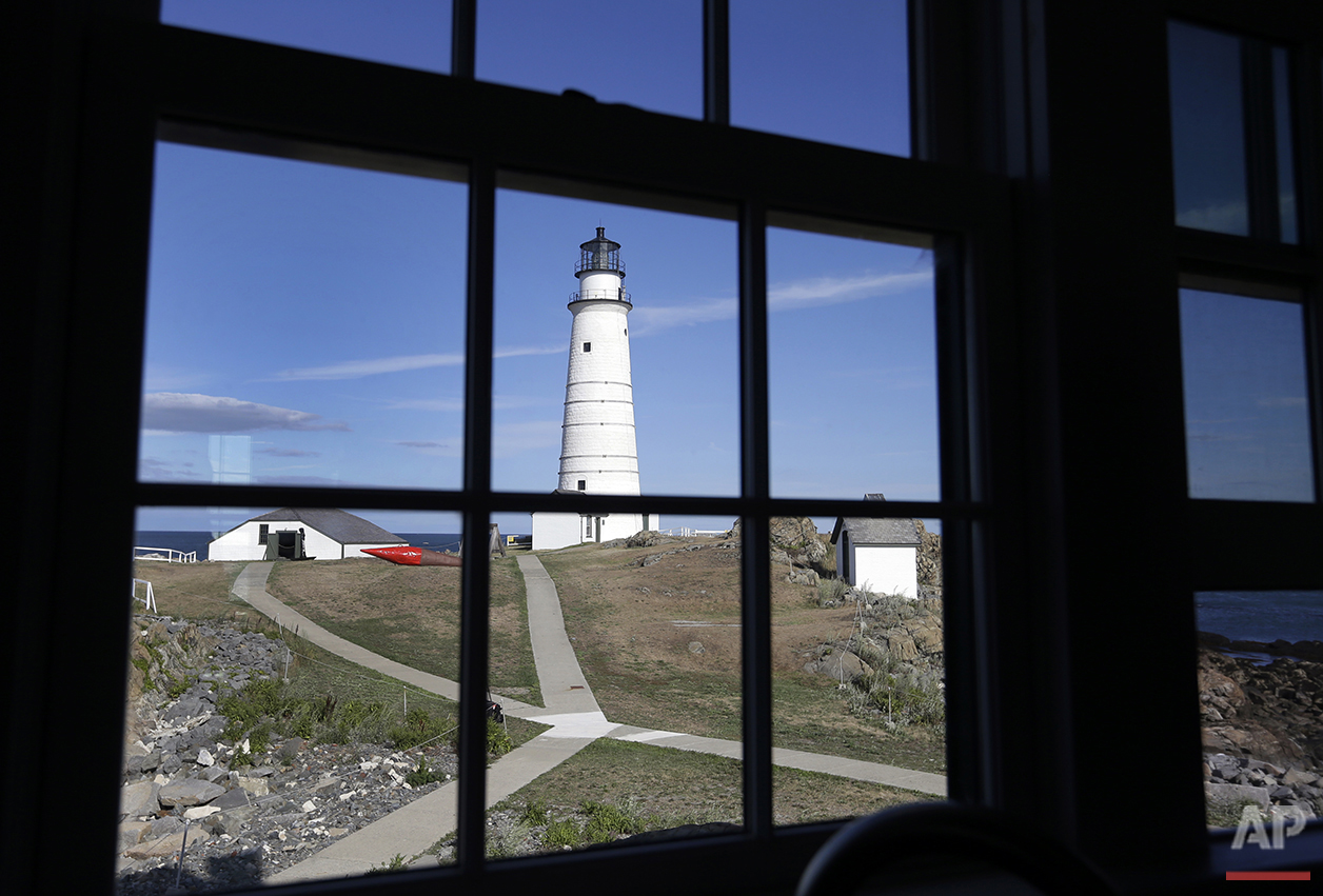  In this Aug. 17, 2016 photo, Boston Light, America's oldest lighthouse, is seen through a window of the keeper's house on Little Brewster Island in Boston Harbor. (AP Photo/Elise Amendola)&nbsp;See these photos on  APImages.com  