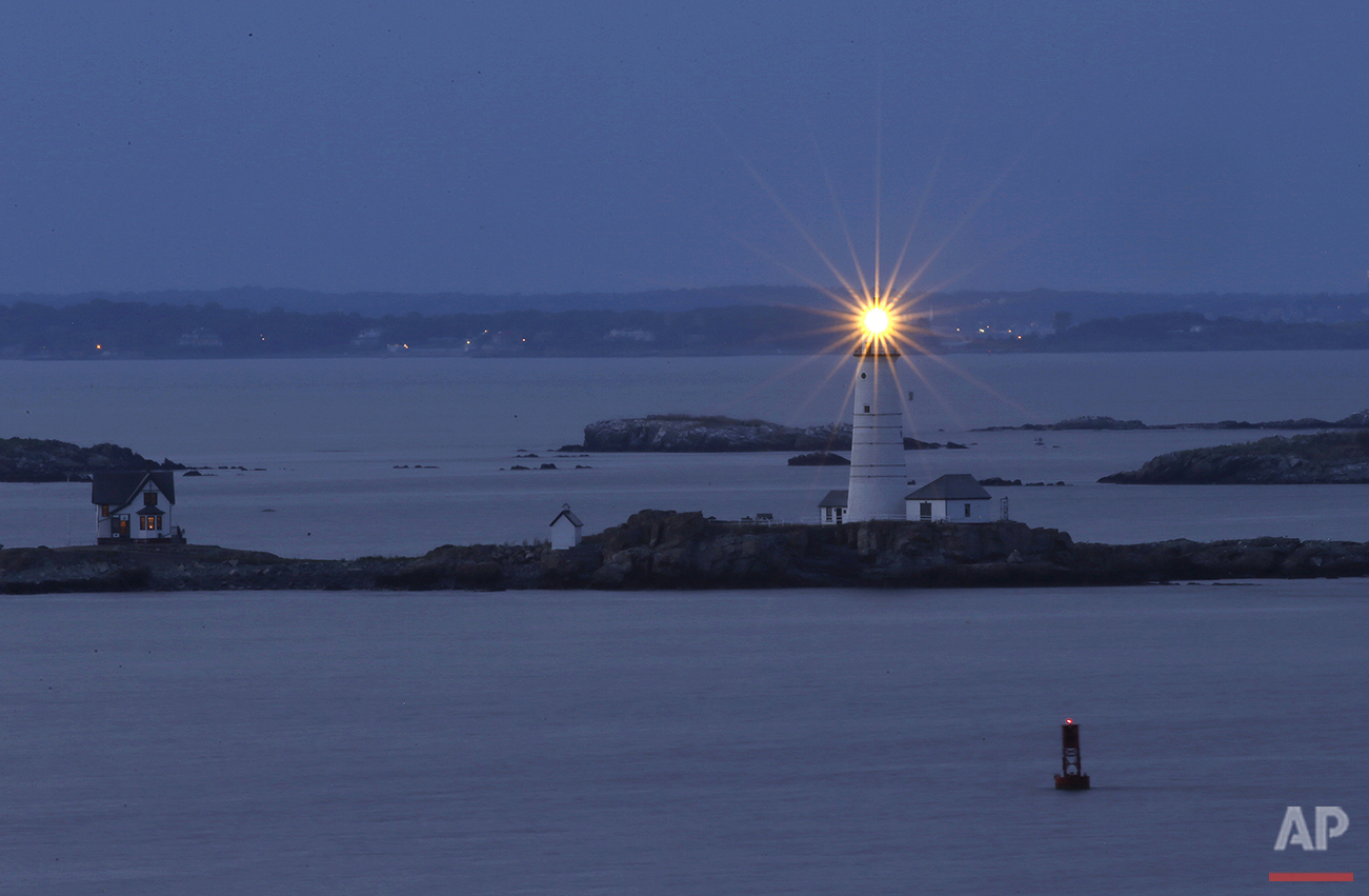  In this Aug. 25, 2016 photo, Boston Light, America's oldest lighthouse, flashes in Boston Harbor as seen from Hull, Mass. (AP Photo/Elise Amendola)&nbsp;See these photos on  APImages.com  