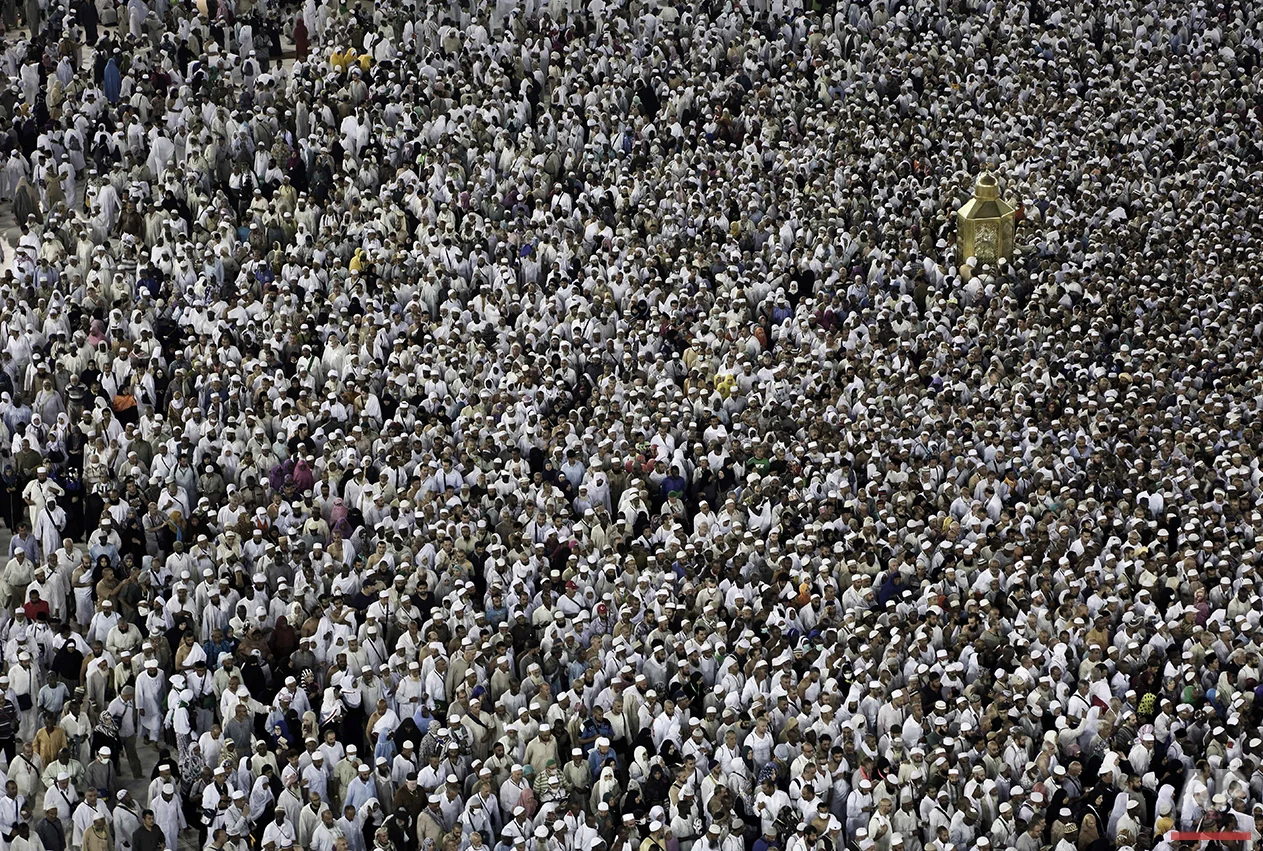  In this Wednesday, Sept. 7, 2016 photo, Muslim pilgrims circle the Kaaba and try to touch Maqam Ibrahim or The Station of Abraham, the golden glass structure top right, at the Grand Mosque in the Muslim holy city of Mecca, Saudi Arabia. Muslim pilgr