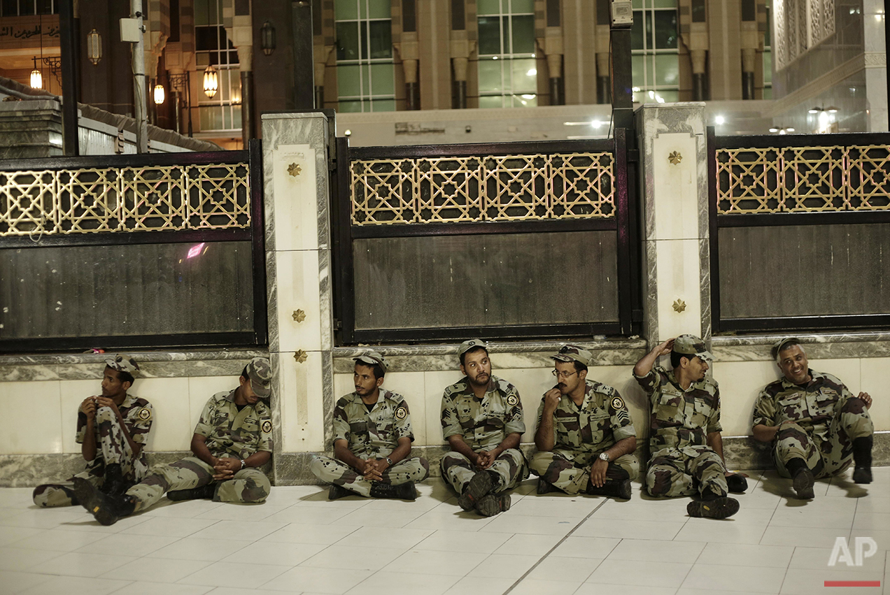  Saudi security rest before praying the Fajr, prayer before sunrise, outside the Grand Mosque in the Muslim holy city of Mecca, Saudi Arabia, Thursday, Sept. 8, 2016. Muslim pilgrims have begun arriving at the holiest sites in Islam ahead of the annu