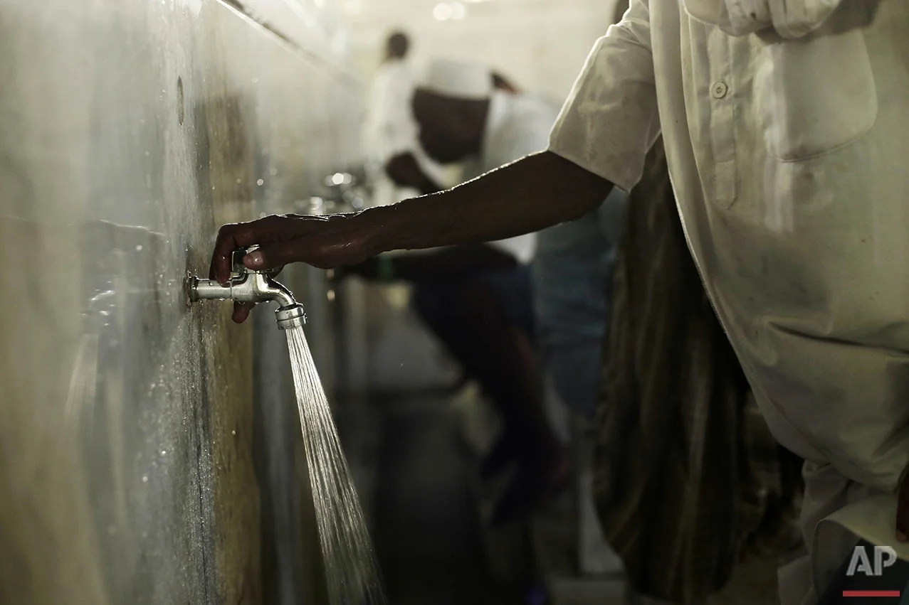  Muslim pilgrim performs Wudu, a ritual washing before prayers, just outside the Grand Mosque in the Muslim holy city of Mecca, Saudi Arabia, Thursday, Sept. 8, 2016. Millions of pilgrims have arrived to Mecca ahead of the Hajj annual pilgrimage whic