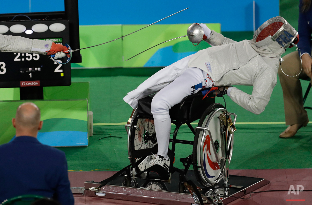  France's Ludovic Lemoine competes in the men's individual sabre, category A, wheelchair fencing event at the Paralympic Games in Rio de Janeiro, Brazil, Monday, Sept. 12, 2016. (AP Photo/Leo Correa) 