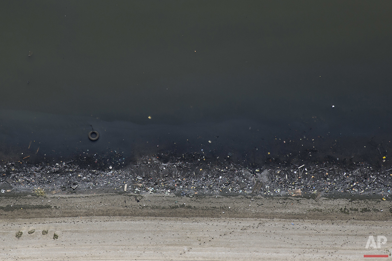  In this July 5, 2016 photo, aerial view shows trash on the shores of Guanabara Bay in Rio de Janeiro. In light of AP's findings on the city's water quality, Dr. Valerie Harwood, Department Chair of Integrative Biology at the University of Southern F