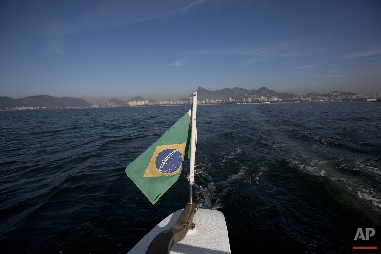  In this July 11, 2016 photo, Brazil's national flag decorates the boat used to collect water samples from Guanabara Bay for an ongoing water quality study commissioned by The Associated Press in Rio de Janeiro. The AP published the first results of 
