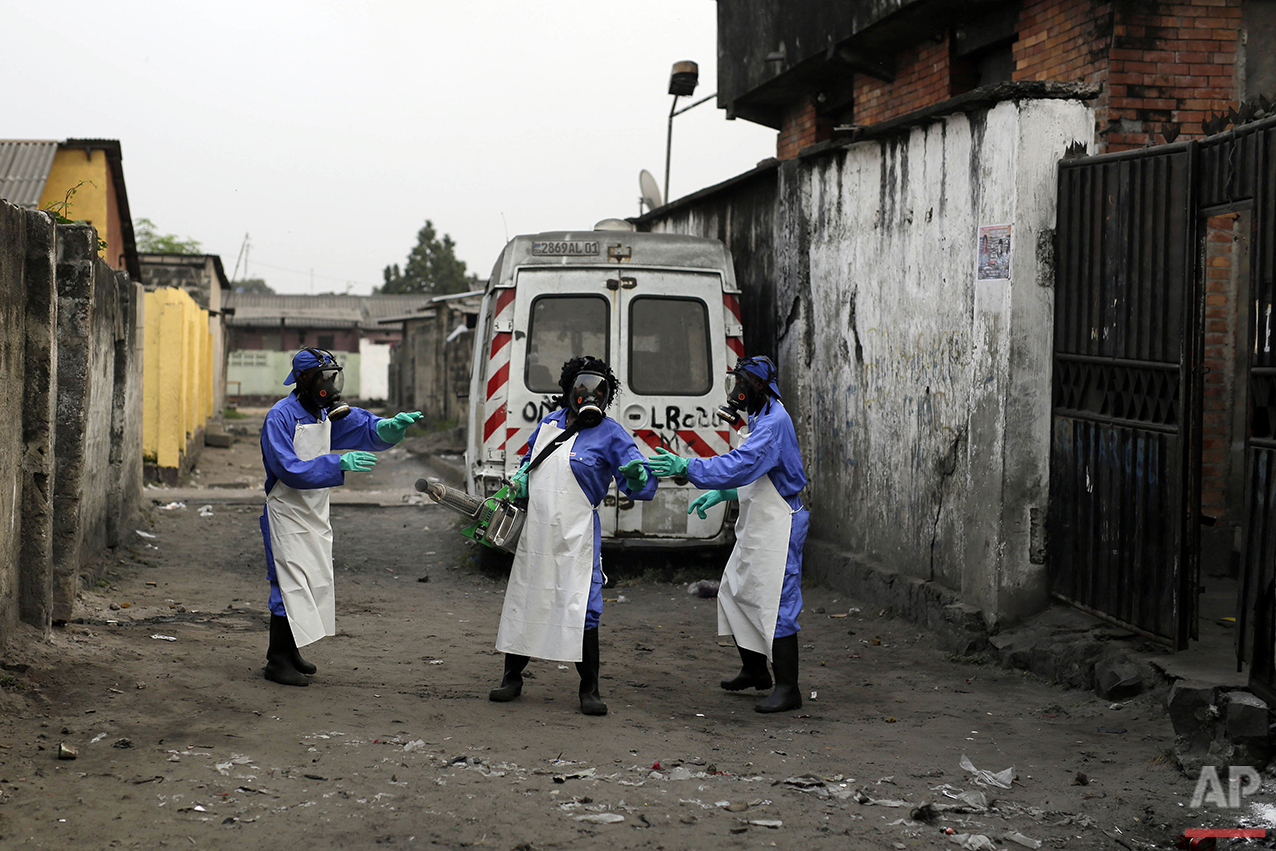  In this photo taken Friday July 22, 2016, teams from MSF carry out fumigation efforts in the Yolo Sud neighborhood of Kinshasa, Democratic Republic of Congo, in a bid to kill the mosquitos that transmit yellow fever.(AP Photo/Jerome Delay) 