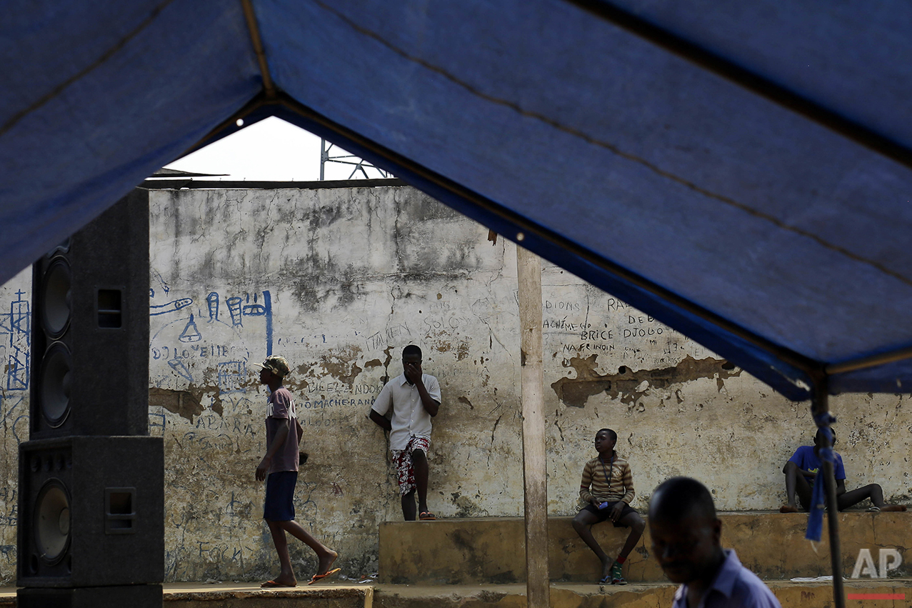  In this photo taken Wednesday July 20, 2016, residents of the Kisenso district of Kinshasa, Democratic Republic of Congo, listen to officials launching a yellow fever vaccination campaign. Nearly 500,000 residents of the Kisenso neighborhood were se