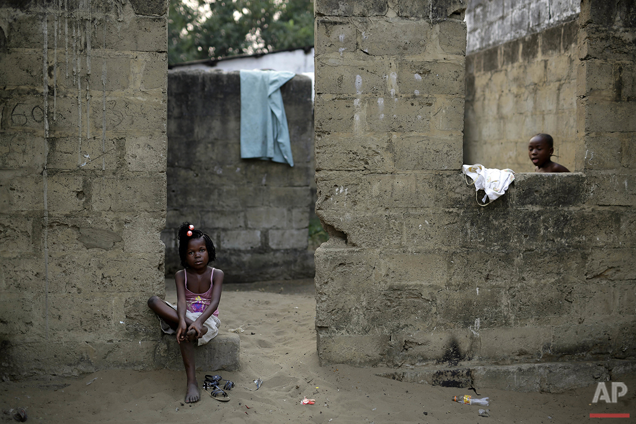  In this photo taken Wednesday July 20, 2016, children sit outside their home in the Kisenso district of Kinshasa, Democratic Republic of Congo. (AP Photo/Jerome Delay) 