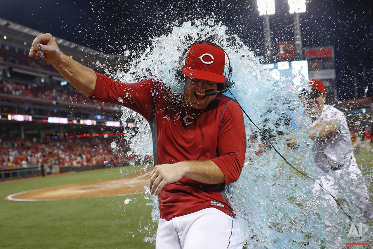  Cincinnati Reds' Scott Schebler is doused by Homer Bailey, right, after hitting a walk-off three run home run off St. Louis Cardinals relief pitcher Seung Hwan Oh during the ninth inning of a baseball game, Tuesday, Aug. 2, 2016, in Cincinnati. The 