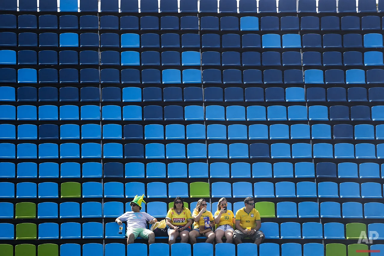 A small group of Brazilian fans attend a women's field hockey match between South Korea and New Zealand at the 2016 Summer Olympics in Rio de Janeiro, Brazil, Sunday, Aug. 7, 2016. (AP Photo/Jae C. Hong)