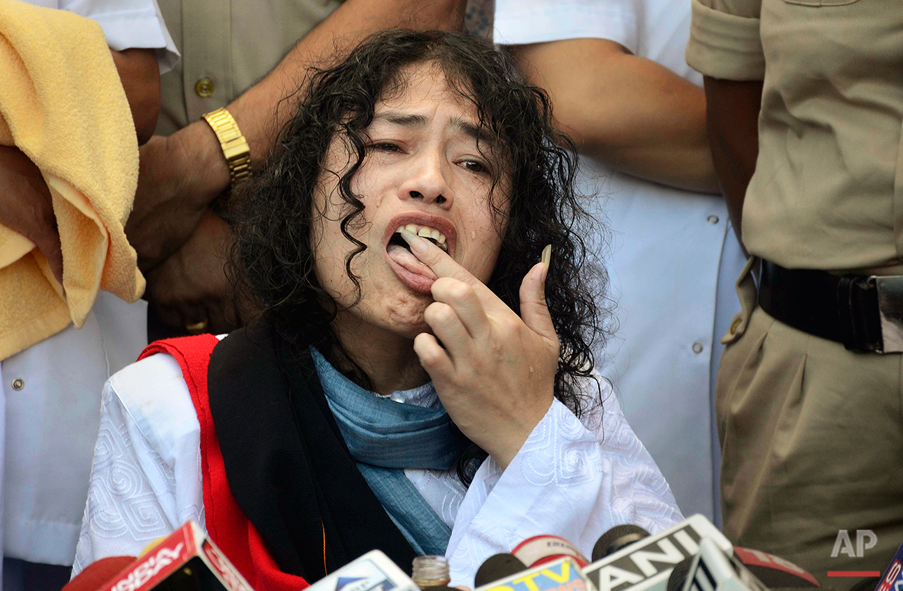  Indian political activist Irom Sharmila licks honey from her hand to break her fast in Imphal, north-eastern Indian state of Manipur, India, Tuesday, Aug. 9, 2016. One of India's most prominent political activists ended a 16-year hunger strike Tuesd