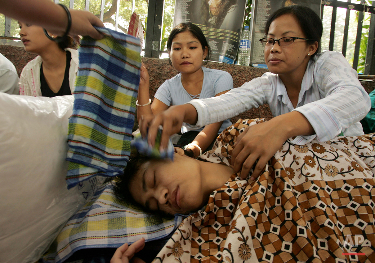  In this Oct. 5, 2006 file photo, Irom Sharmila is attended to by supporters at a protest to demand the repeal of the Armed Forces Special Powers Act in her home state of Manipur, in New Delhi, India. (AP Photo/Gurinder Osan) 