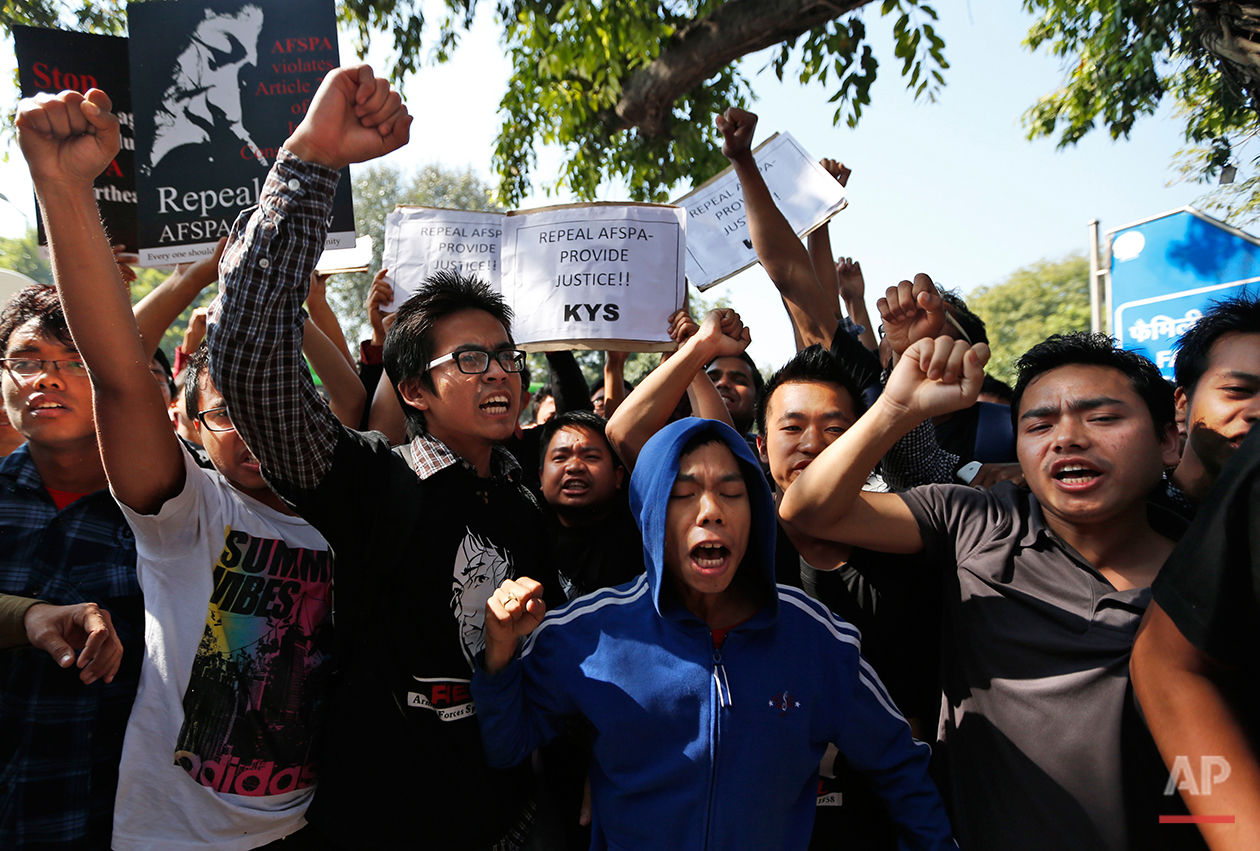  Supporters of Irom Sharmila, unseen, who has been on a decade-long hunger strike protesting an anti-terror law, shout slogans in her favor after being barred from entering the court premises as Sharmila is produced there, in New Delhi, India, Monday