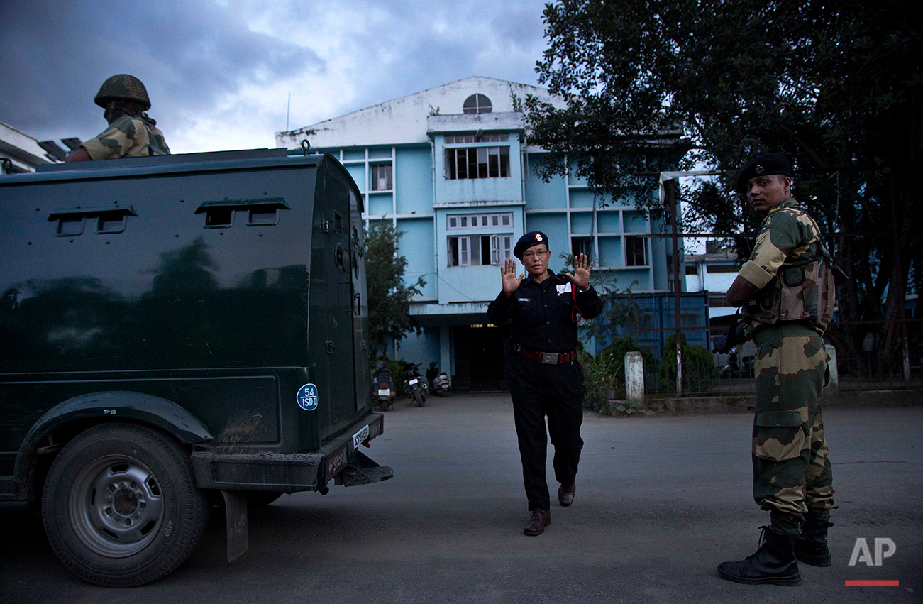  A security officer gestures as he objects to taking photographs outside the Jawaharlal Nehru hospital where Indian activist Irom Sharmila has been kept in judicial custody in Imphal, northeastern Manipur state, India, Monday, Aug.8, 2016. The 44-yea