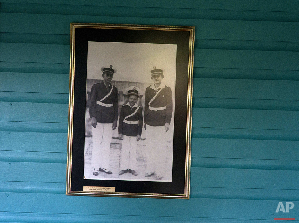  This June 10, 2016 photo shows a family photograph of the Castro brothers, from left, Fidel, Raul and Ramon, on the wall of the room they shared as children in Biran, Cuba. Since 2002, the site has been a museum, and it is gaining increasing attenti