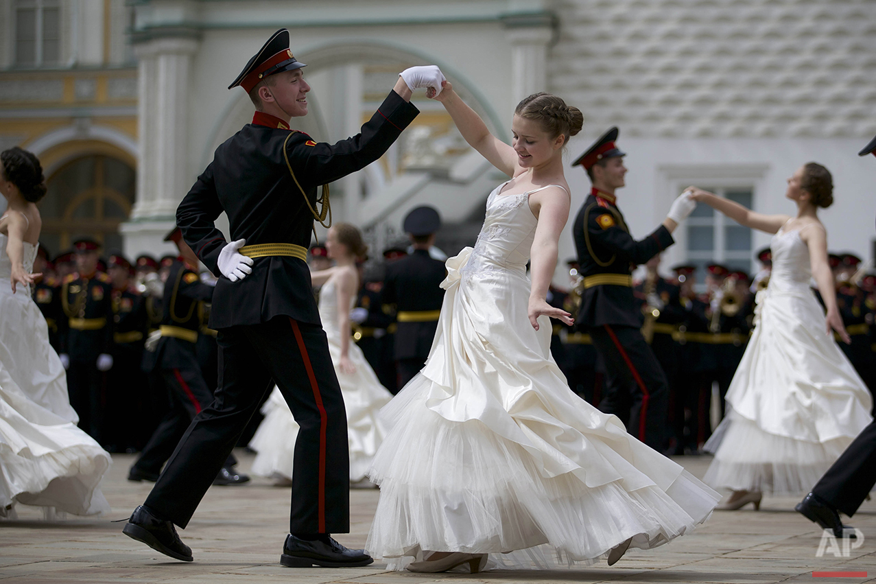 Russian cadets dance a waltz during their graduation ceremony in Moscow, on Saturday, June 25, 2016. After giving the oath to the Russian flag, graduates of Moscow cadet schools received their diplomas during an official ceremony held inside of the Kremlin. (AP Photo/Ivan Sekretarev)