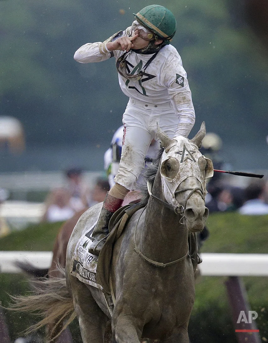 Jockey Irad Ortiz Jr., riding Creator, celebrates after winning the 148th running of the Belmont Stakes horse race, Saturday, June 11, 2016, in Elmont, N.Y. (AP Photo/Peter Morgan)